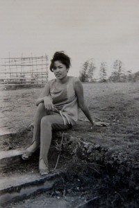 Marnie Simeon Malicse, sitting at the same steps leading to the hill behind Aguipo Elementary School where the Earth House now stands