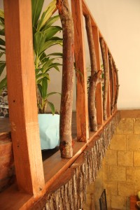 Creativity in maximizing use of materials - Branches for railing…. Bark covers the bottom of the railings.
