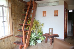 Stairs to the Loft/ Mezzanine.  Sconces for candles shown as an option for designs without electricity.