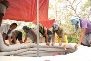 The Emergency Shelter Dome easily supported 8 adults standing (photographer included) as it was being built.